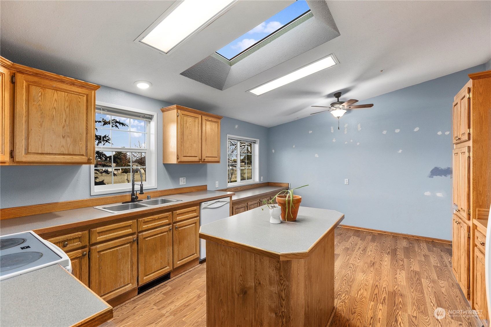 208 Carlsborg Road Sequim, WA 98382 - Photo 11 of 40 a kitchen with a sink appliances and cabinets