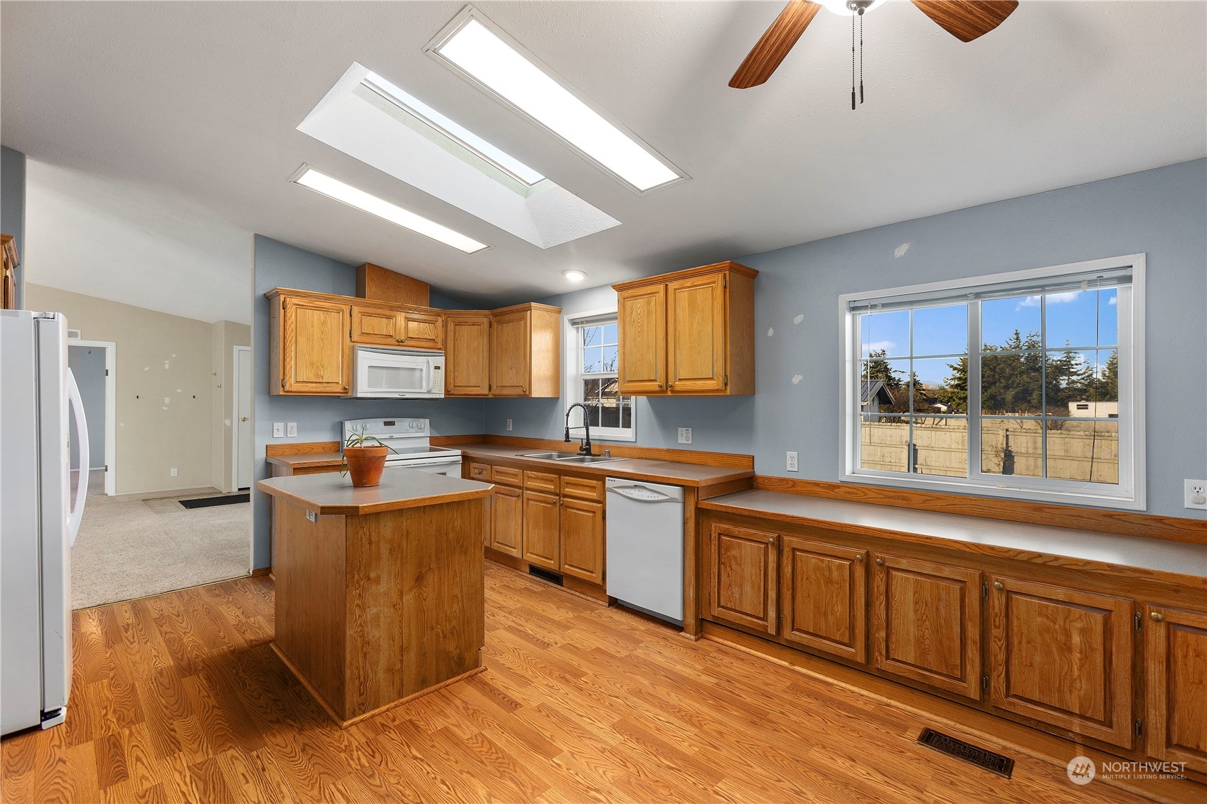 208 Carlsborg Road Sequim, WA 98382 - Photo 12 of 40 a large kitchen with stainless steel appliances granite countertop a sink and cabinets