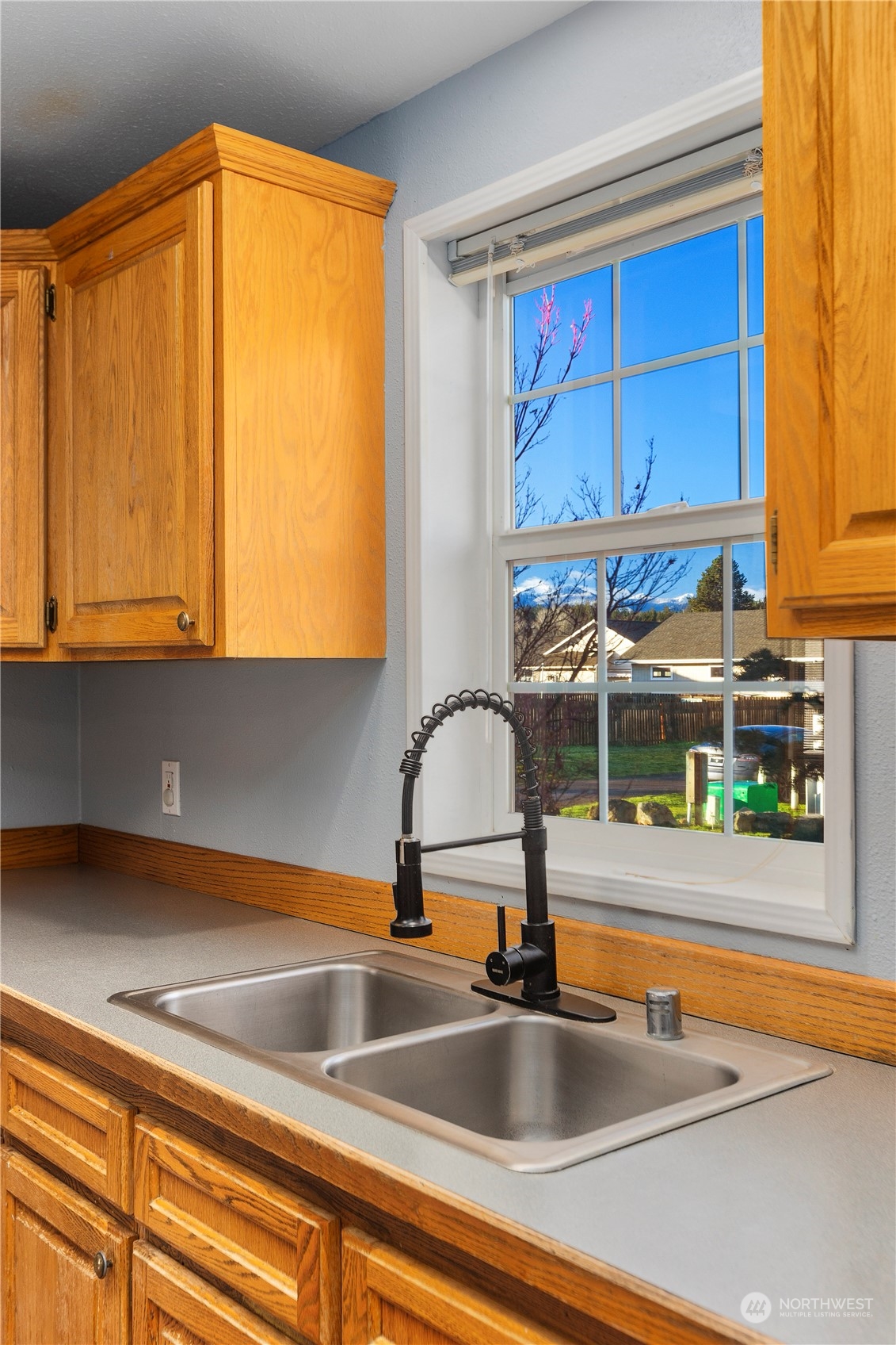 208 Carlsborg Road Sequim, WA 98382 - Photo 16 of 40 a kitchen with a sink and a window