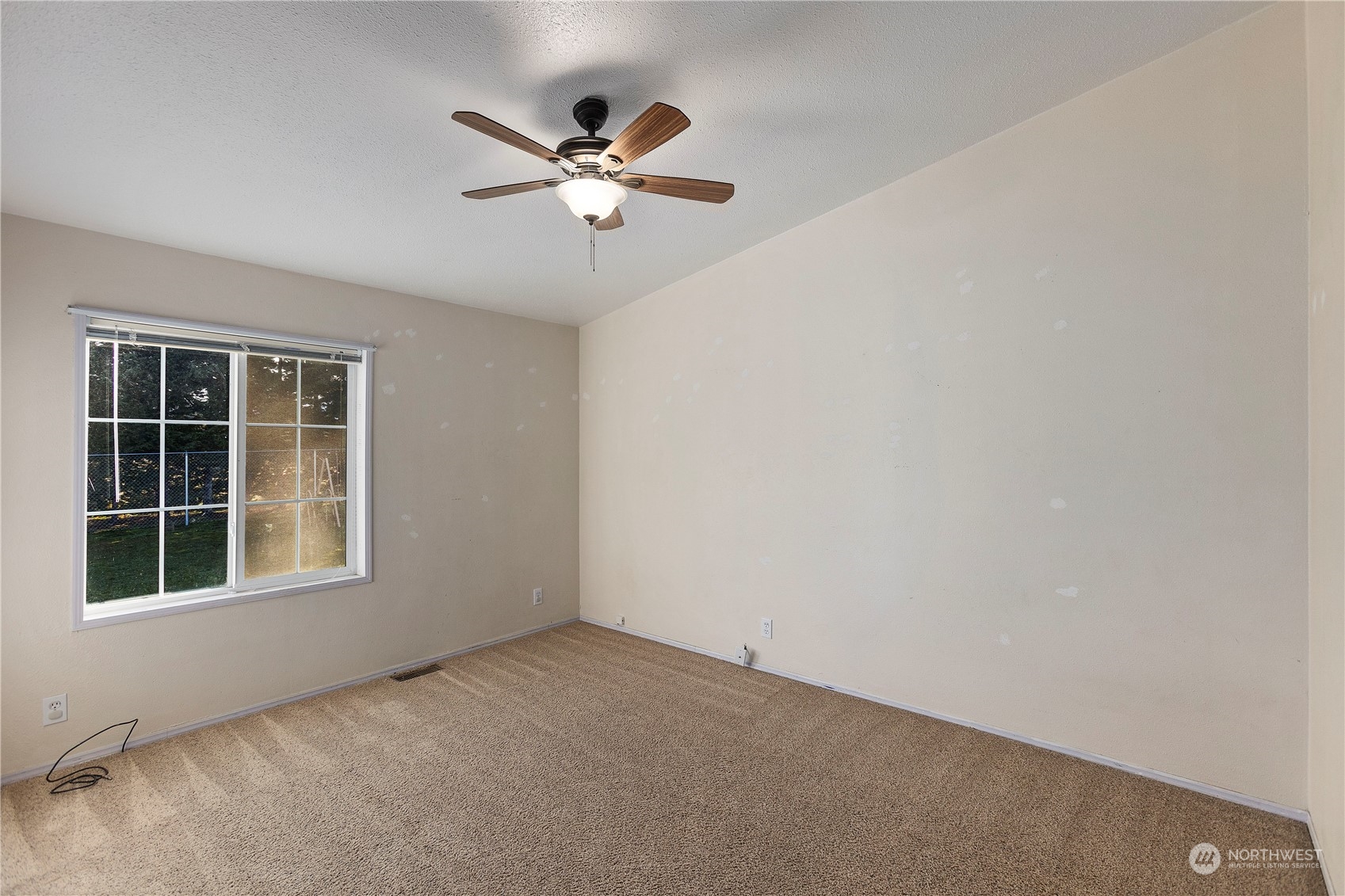 208 Carlsborg Road Sequim, WA 98382 - Photo 19 of 40 a view of empty room with windows