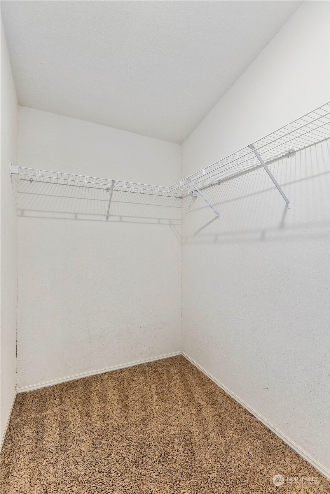 208 Carlsborg Road Sequim, WA 98382 - Photo 26 of 40 a view of a room with racks on the wall