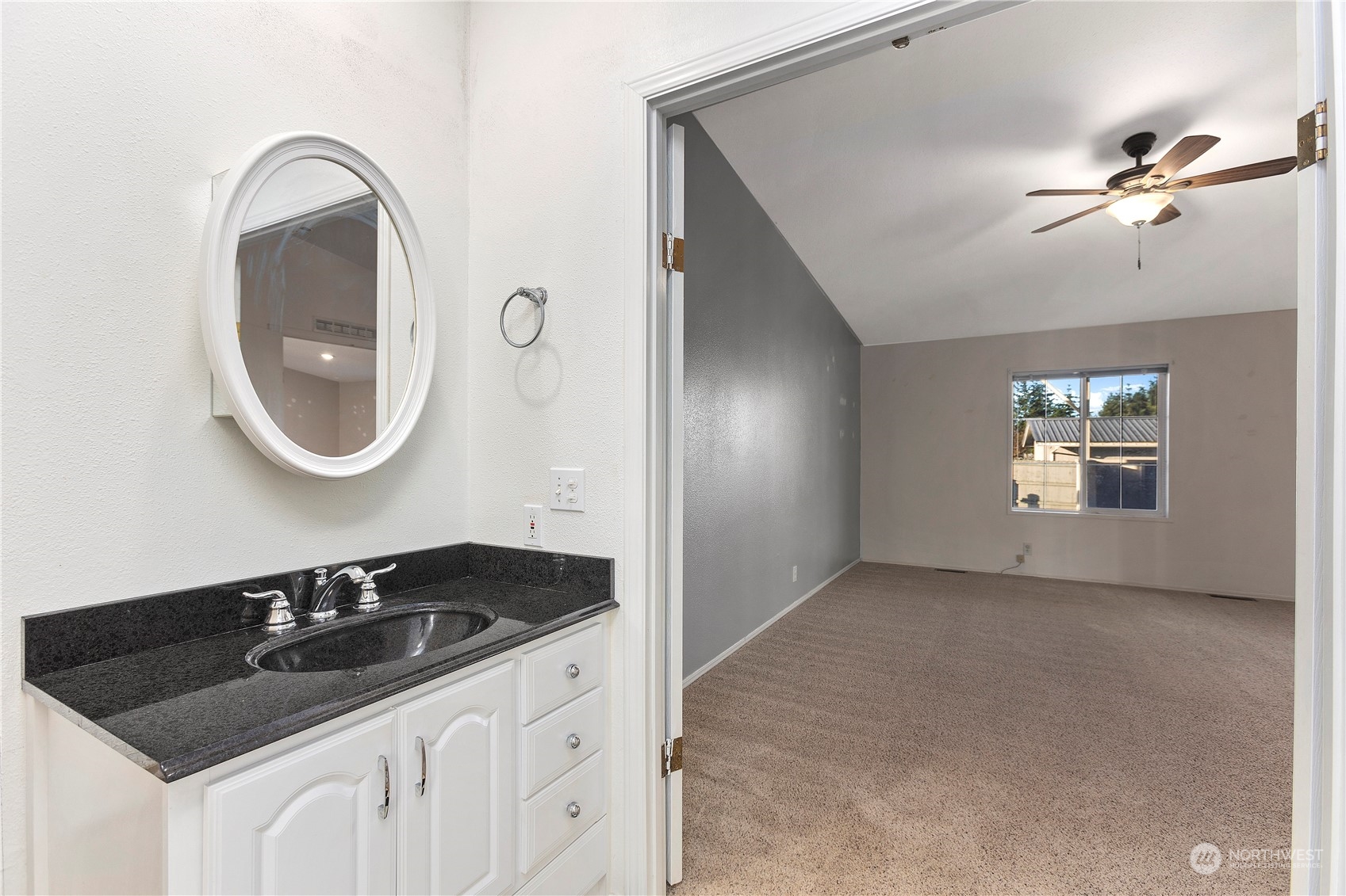 208 Carlsborg Road Sequim, WA 98382 - Photo 28 of 40 a bathroom with a sink and a mirror