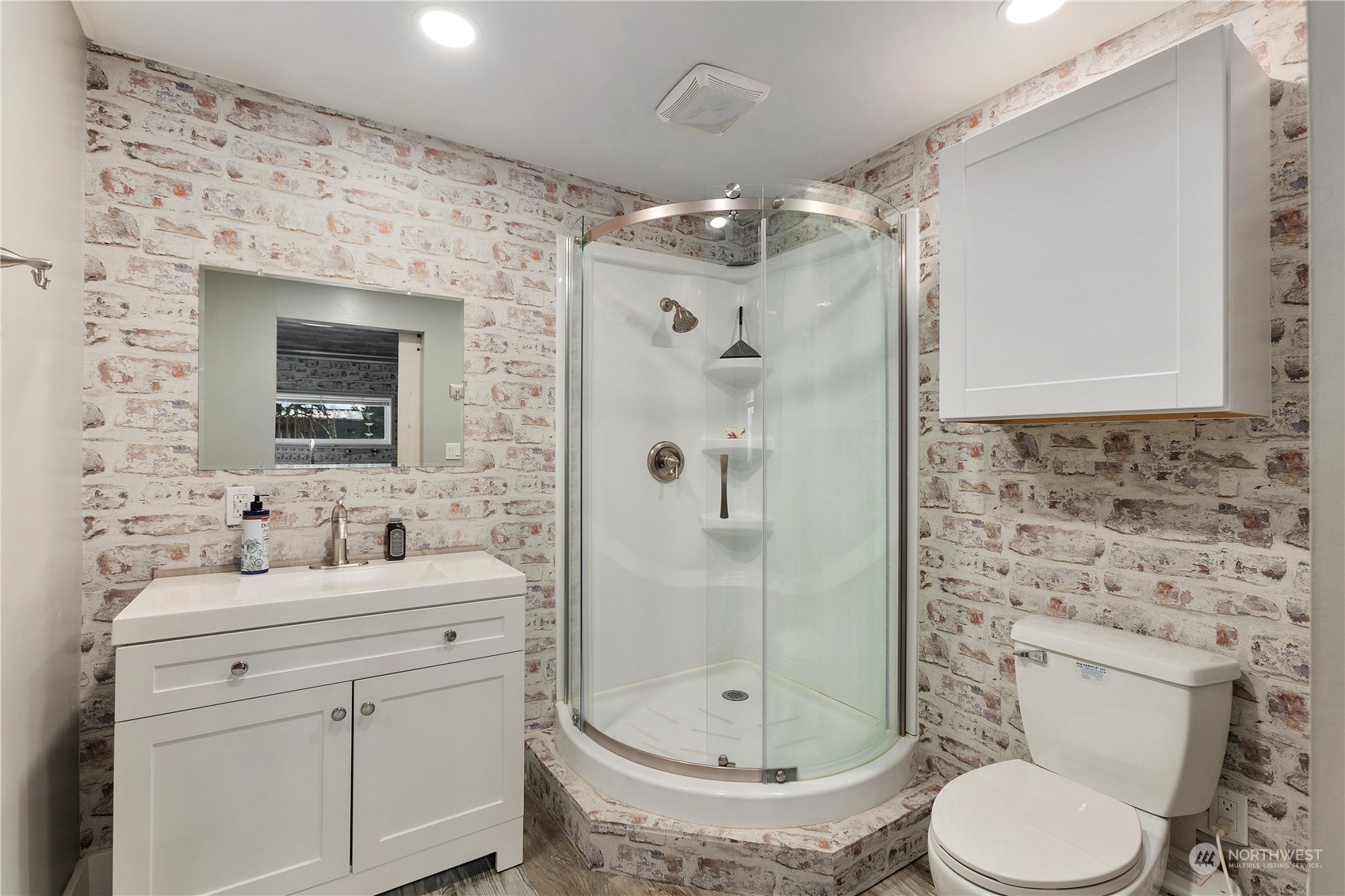 208 Carlsborg Road Sequim, WA 98382 - Photo 35 of 40 a bathroom with a toilet sink shower and mirror