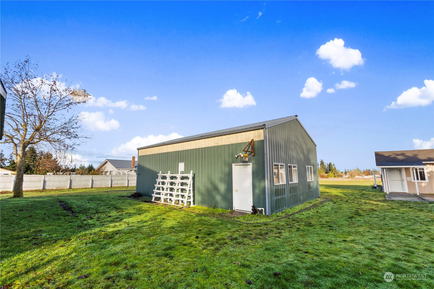 208 Carlsborg Road Sequim, WA 98382 - Photo 39 of 40 a front view of a house with a yard