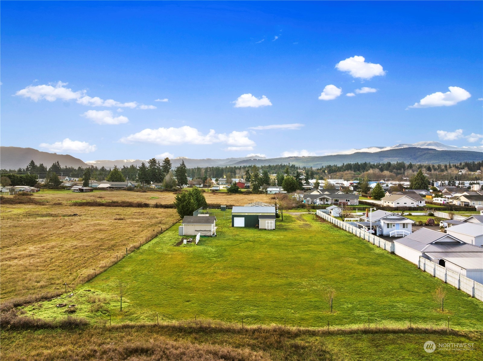 208 Carlsborg Road Sequim, WA 98382 - Photo 40 of 40 a view of a lake with a mountain
