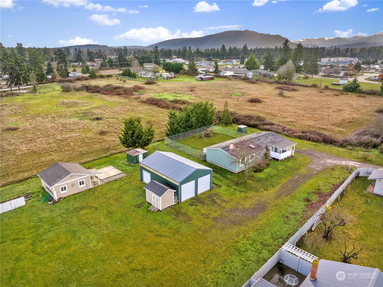 208 Carlsborg Road Sequim, WA 98382 - Photo 6 of 40 a view of a city with lawn chairs