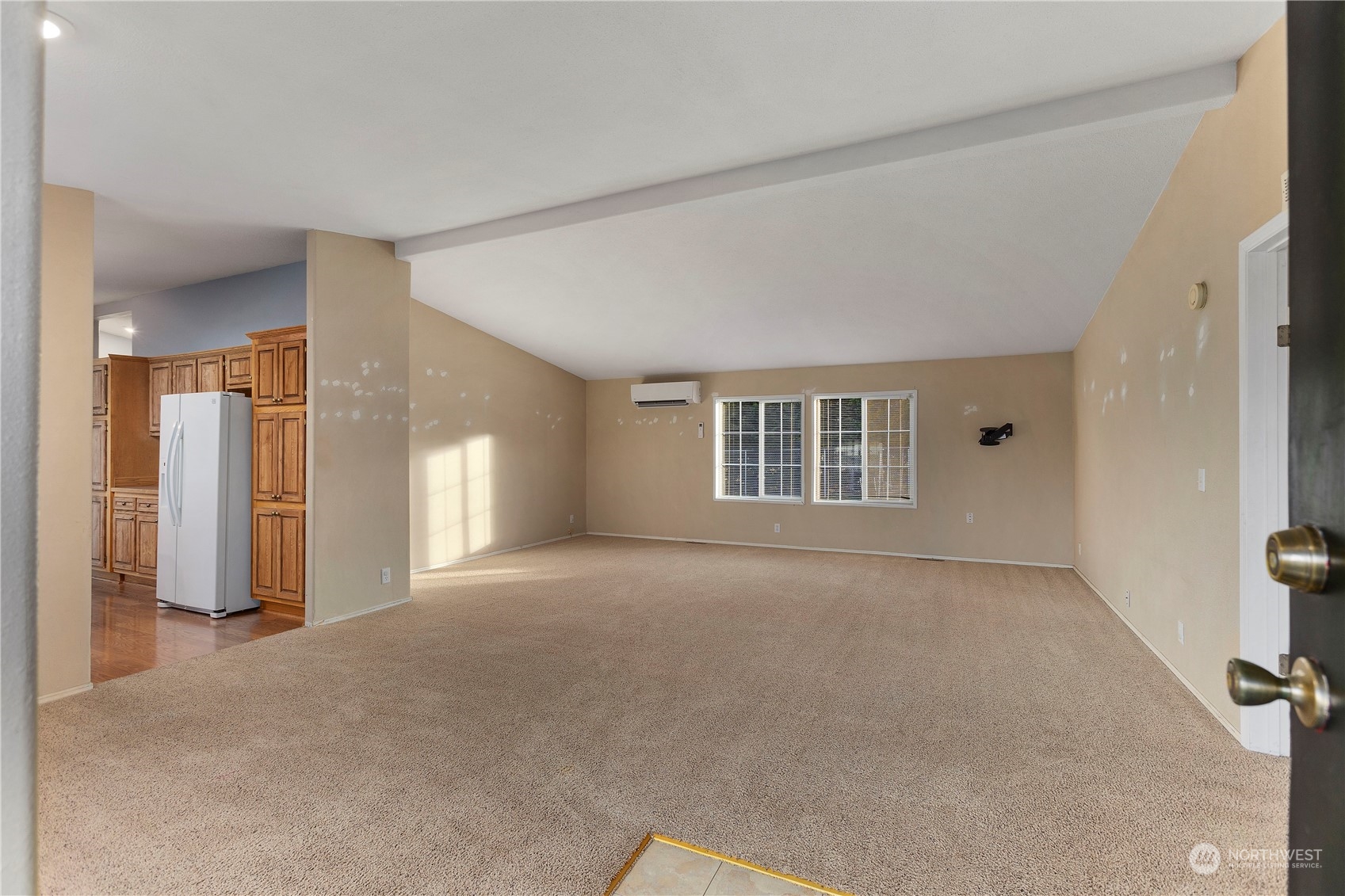 208 Carlsborg Road Sequim, WA 98382 - Photo 8 of 40 a view of a big room with windows and chandelier