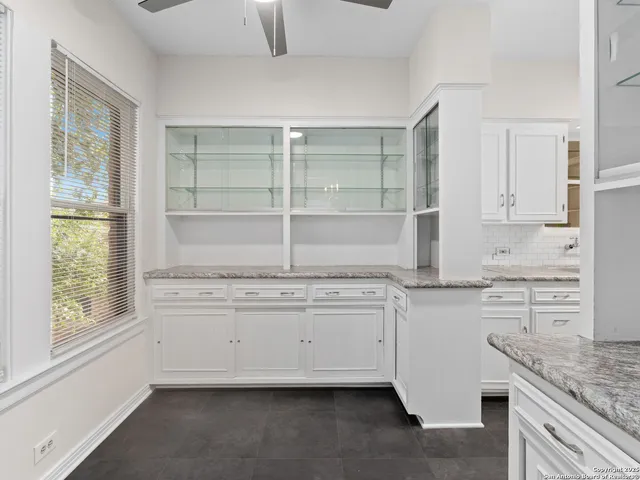 a kitchen with stainless steel appliances granite countertop a stove sink and cabinets