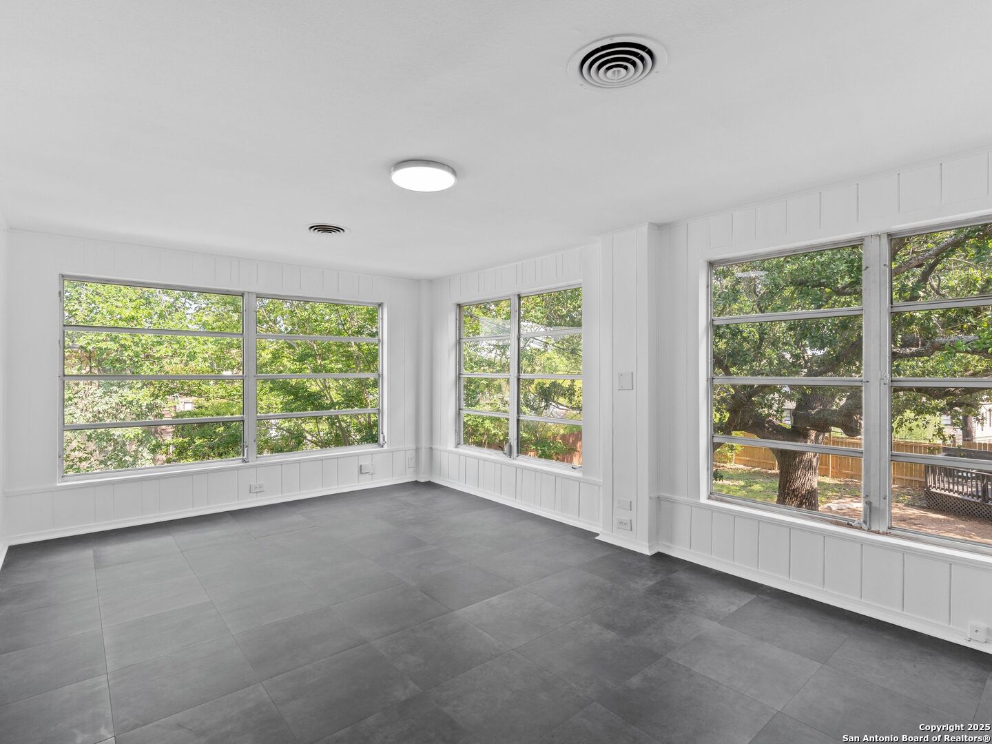 146 Terrell Road Alamo Heights, TX 78209 - Photo 19 of 29 a view of an empty room with a window