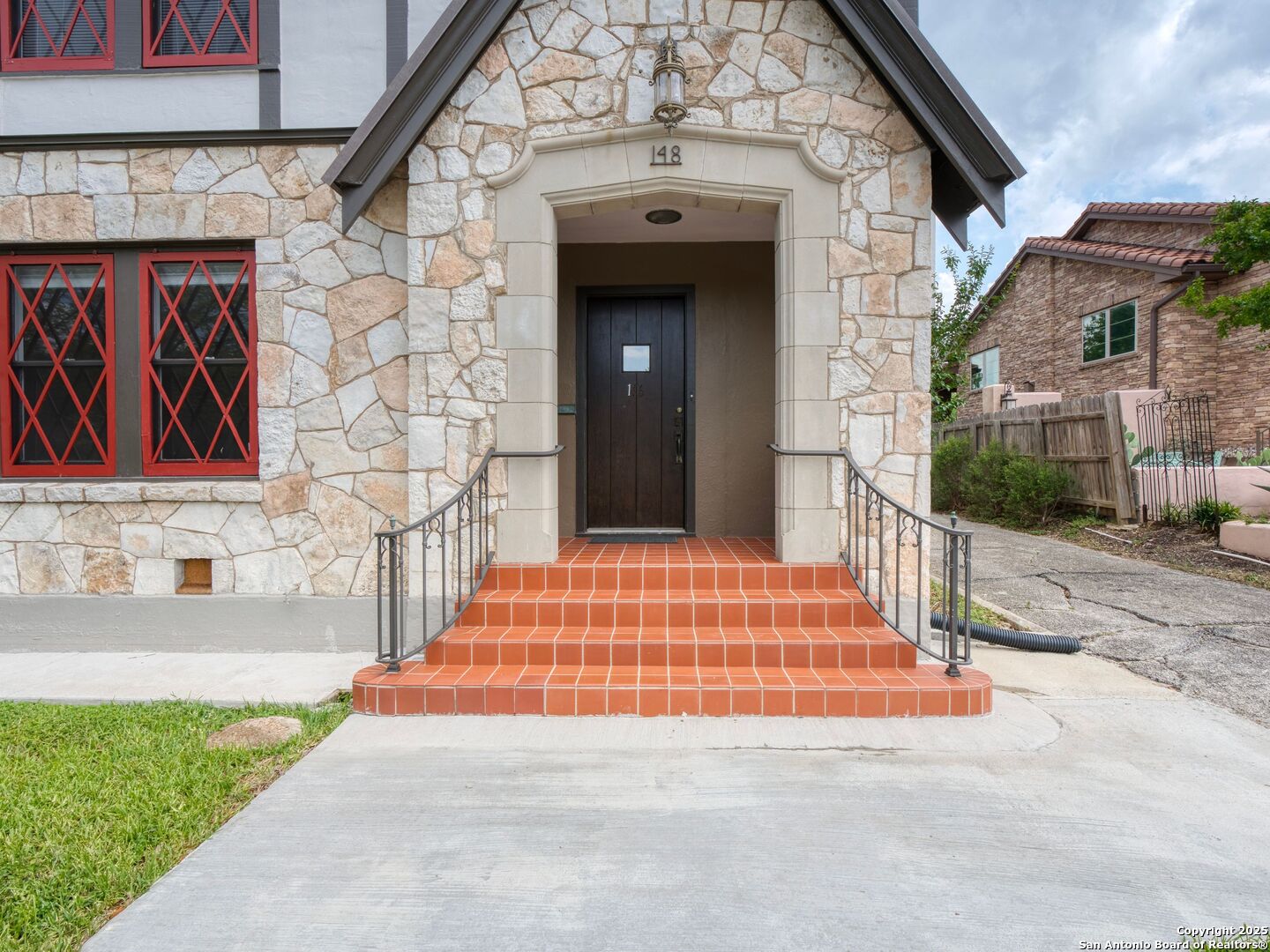 146 Terrell Road Alamo Heights, TX 78209 - Photo 2 of 29 a view of a brick house with large windows