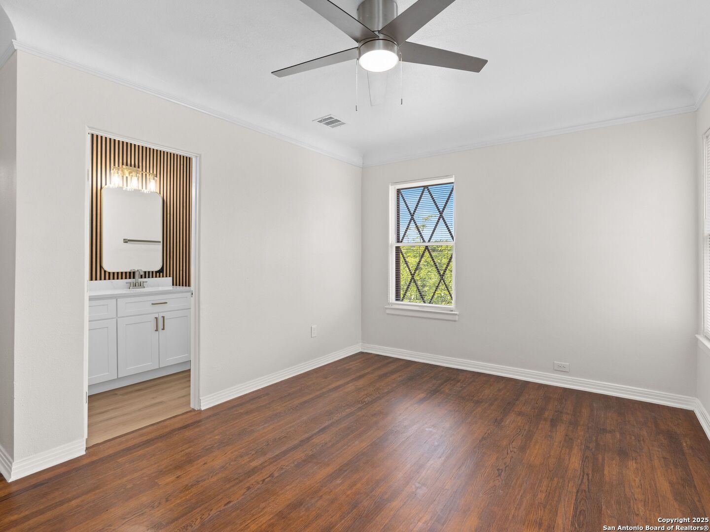 146 Terrell Road Alamo Heights, TX 78209 - Photo 25 of 29 wooden floor in an empty room with a window