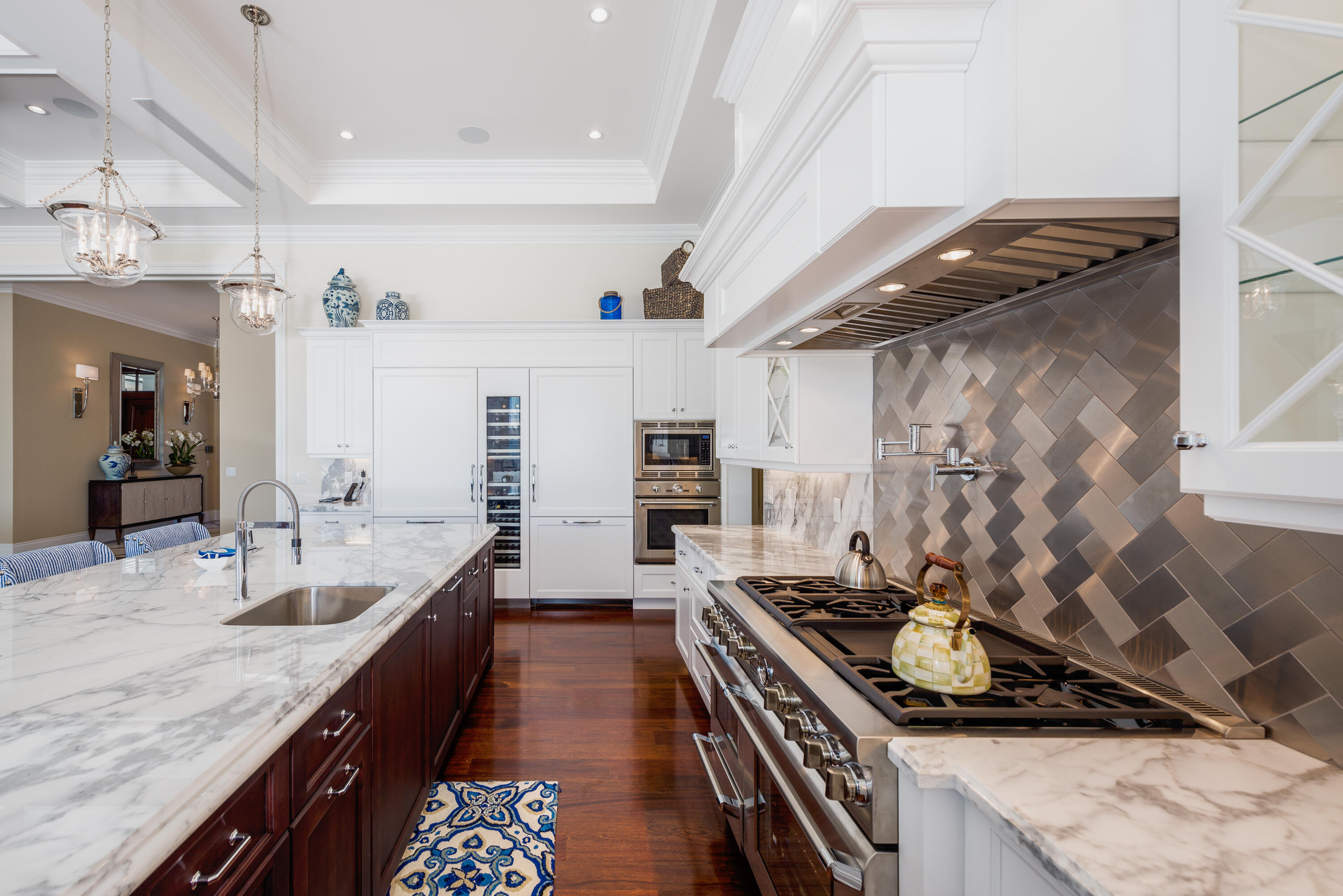 976 Cypress Drive Delray Beach, FL 33483 - Photo 11 of 38 a kitchen with sink stove and cabinets