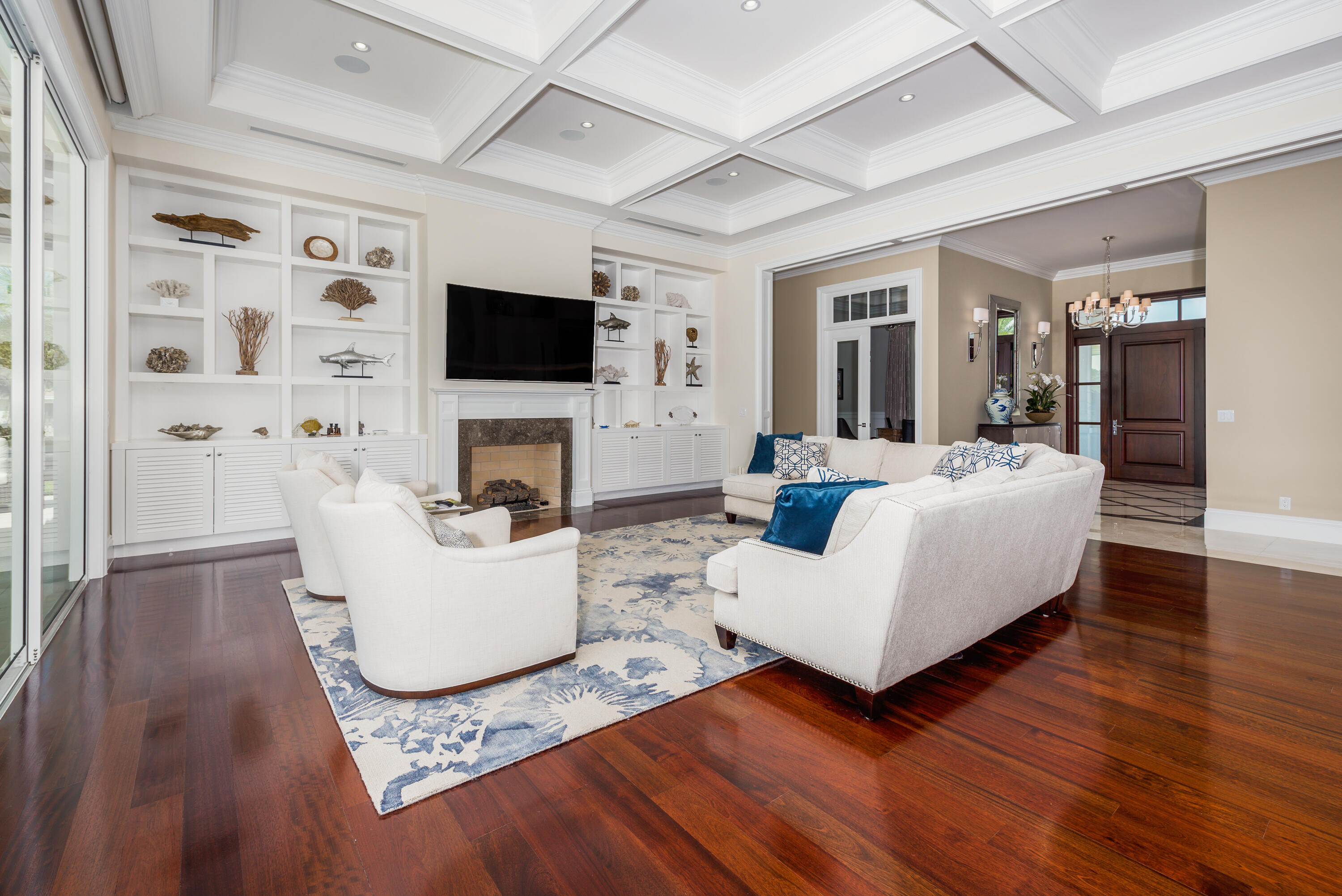 976 Cypress Drive Delray Beach, FL 33483 - Photo 16 of 38 a living room with fireplace furniture and a flat screen tv