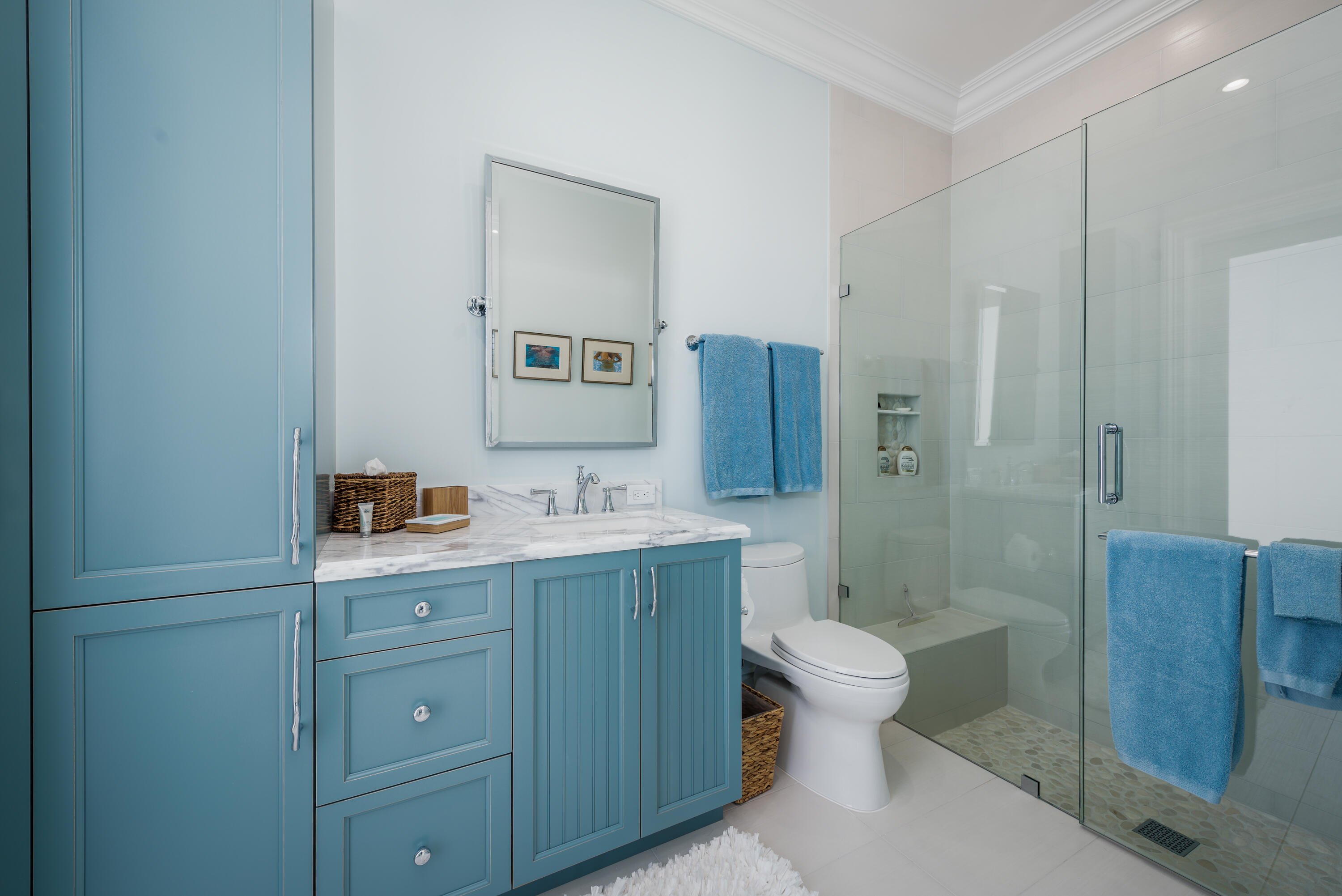 976 Cypress Drive Delray Beach, FL 33483 - Photo 26 of 38 a bathroom with a sink a toilet a shower and a mirror