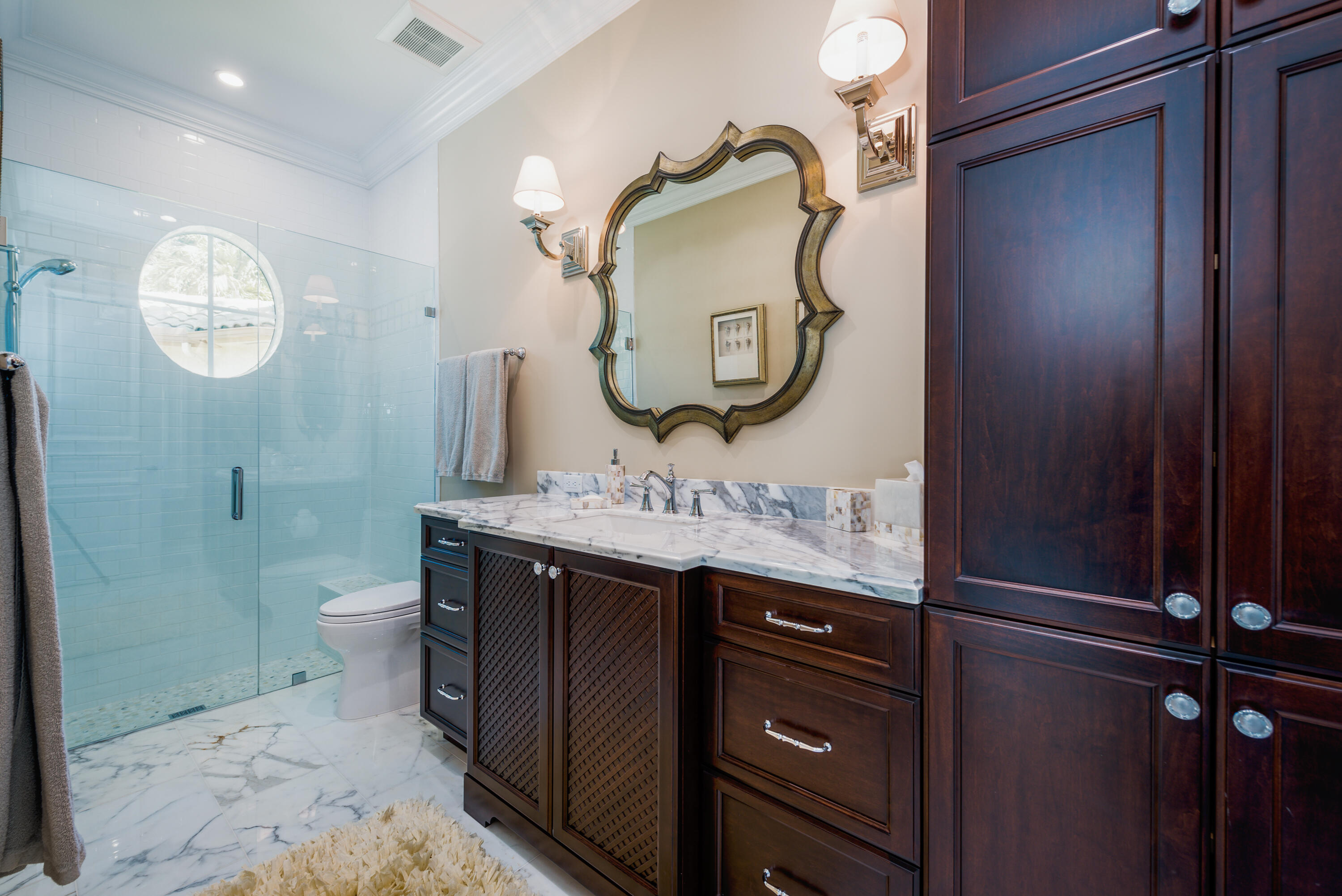 976 Cypress Drive Delray Beach, FL 33483 - Photo 28 of 38 a bathroom with a sink and a mirror