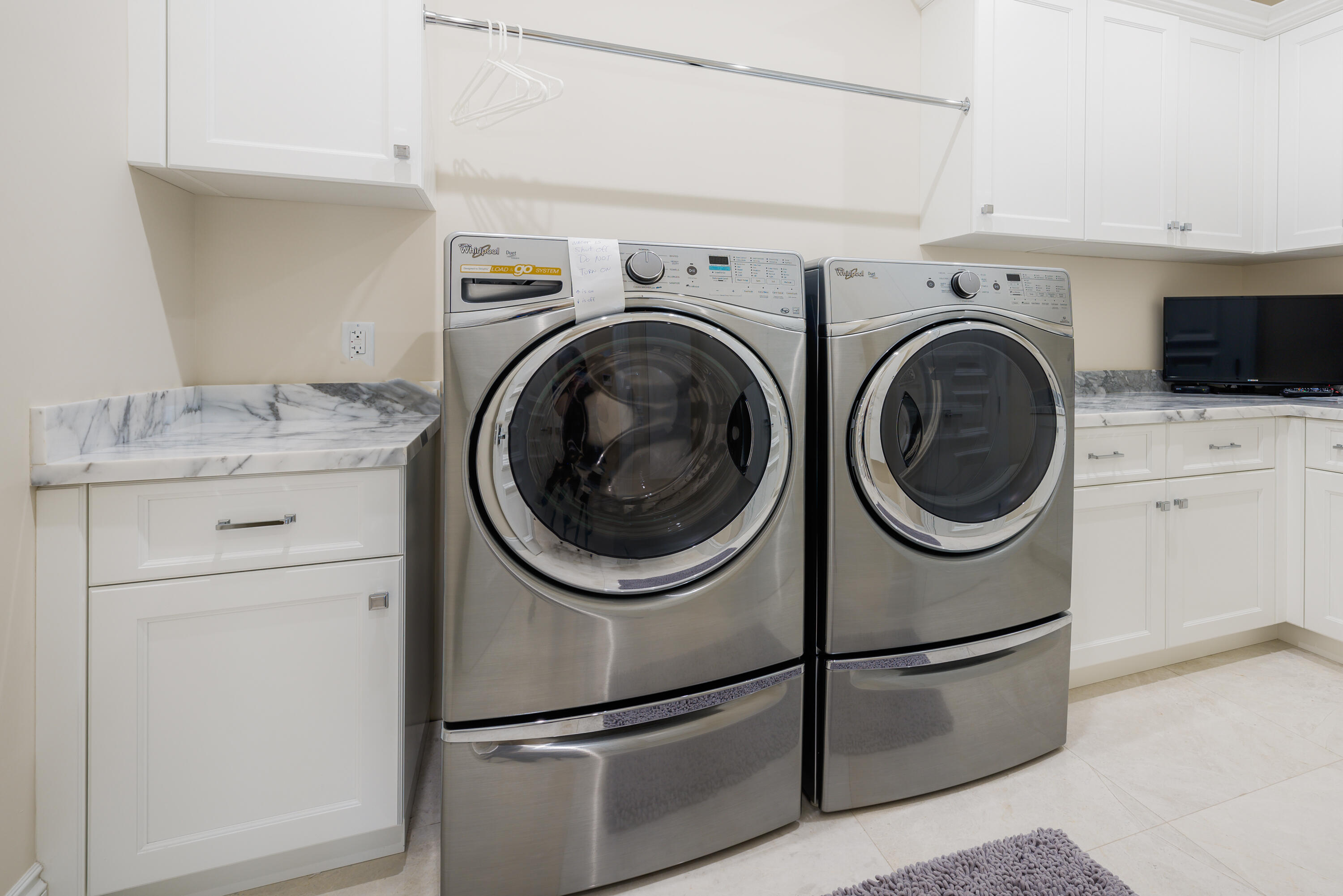 976 Cypress Drive Delray Beach, FL 33483 - Photo 31 of 38 a utility room with dryer and washer