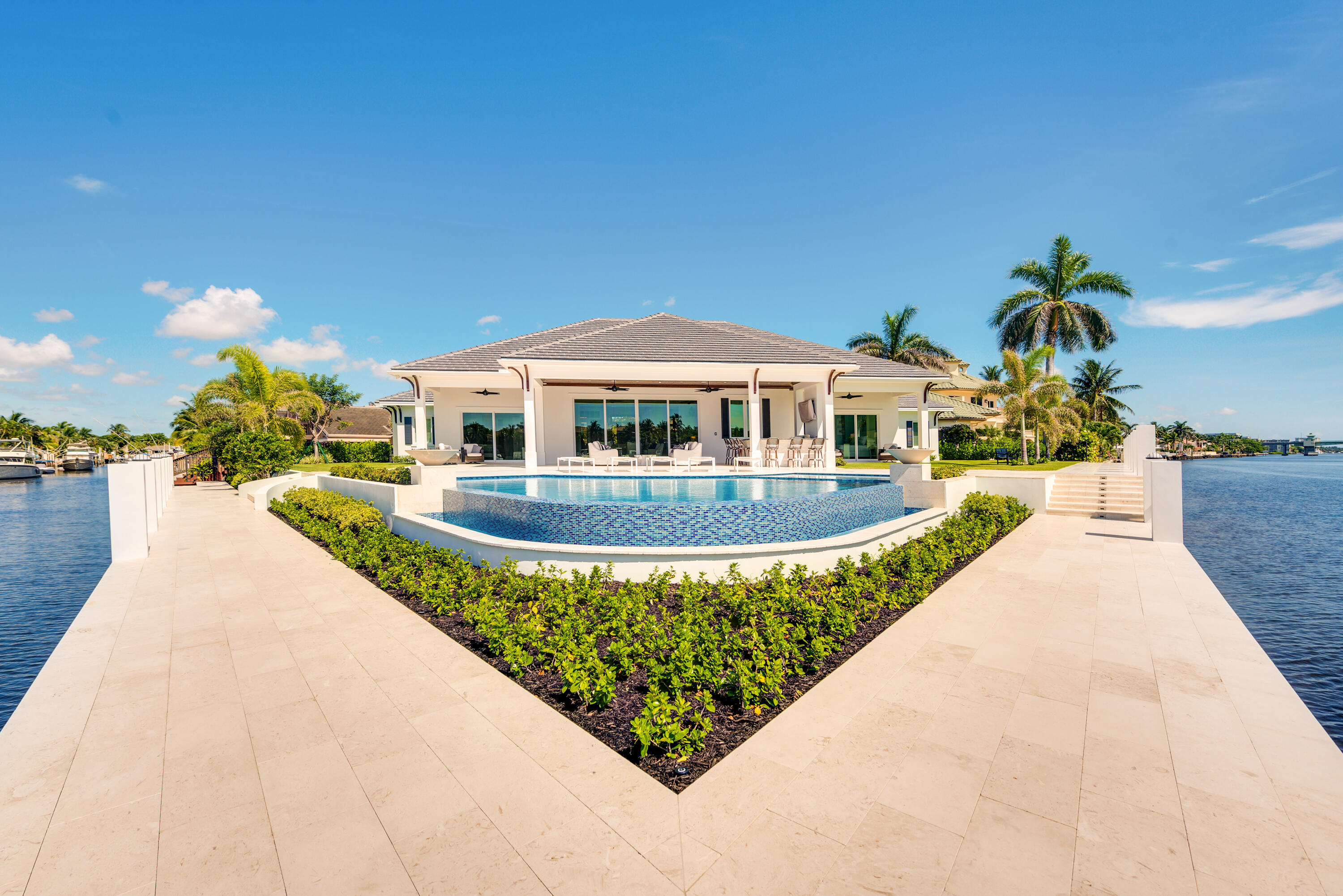 976 Cypress Drive Delray Beach, FL 33483 - Photo 37 of 38 a view of a swimming pool with a patio