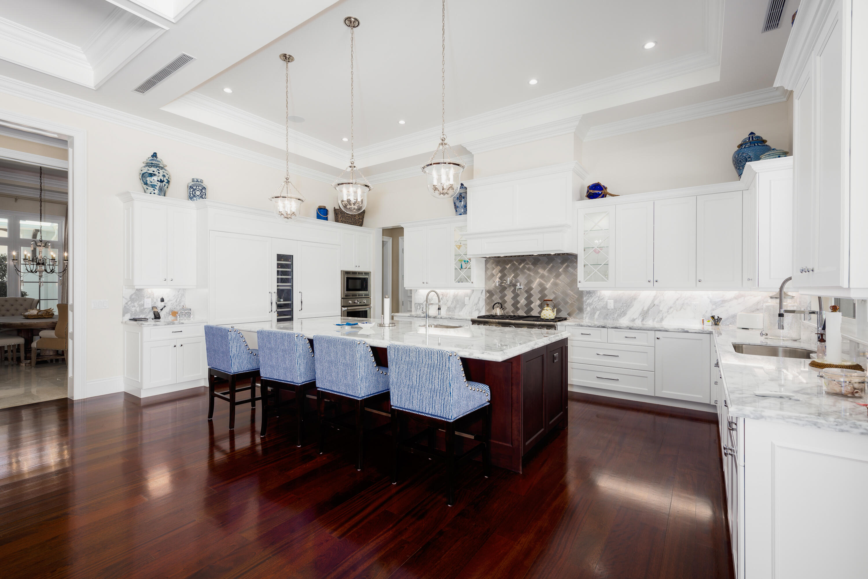 976 Cypress Drive Delray Beach, FL 33483 - Photo 8 of 38 a kitchen with granite countertop a sink cabinets and wooden floor