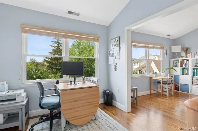 a work room with furniture and a window