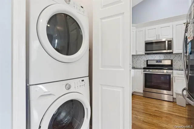 a view of kitchen with sink and a refrigerator