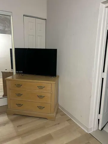 a view of room with flat screen tv