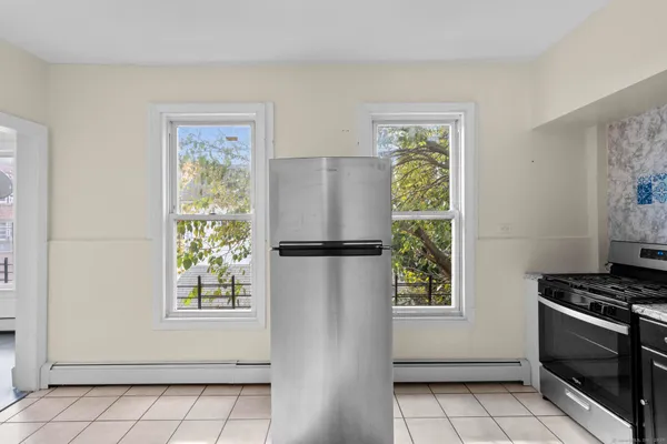 a view of kitchen with window and stainless steel appliances