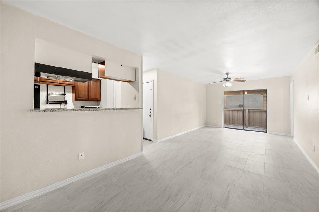 8110 Skillman Street, Unit 2053 Dallas, TX 75231 - Photo 4 of 12 a view of a kitchen with a sink and cabinet
