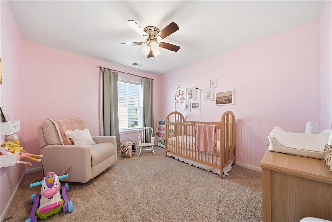 403 Seaborn Circle Pendleton, SC 29670 - Photo 25 of 47 This serene nursery features carpet flooring and a ceiling fan for comfort.