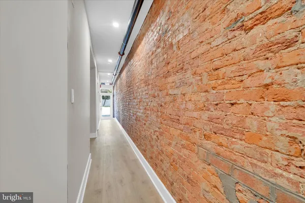 a hallway with wooden floor