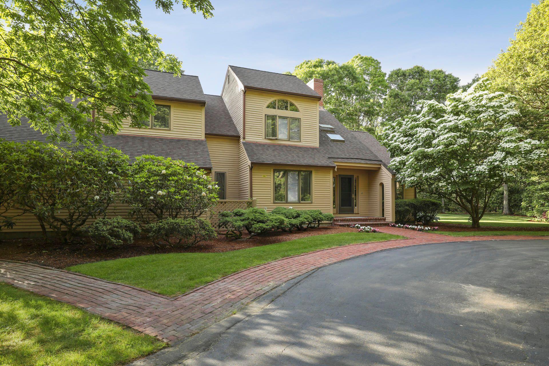 60 Smoke Valley Road Osterville, MA 02655 - Photo 6 of 12 a front view of a house with a yard and trees