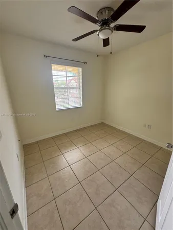 a view of an empty room and a window