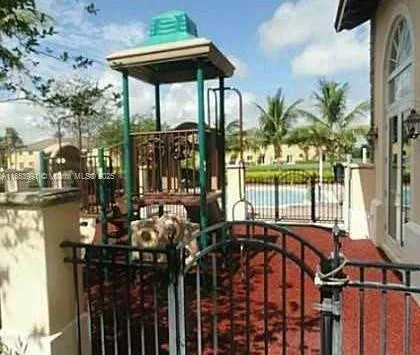 a view of a patio with table and chairs potted plants with wooden floor