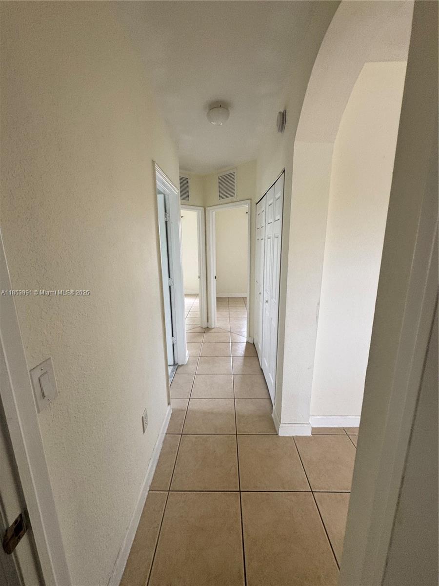 1485 Northeast 33rd Road, Unit 2121 Homestead, FL 33033 - Photo 10 of 19 a view of a hallway