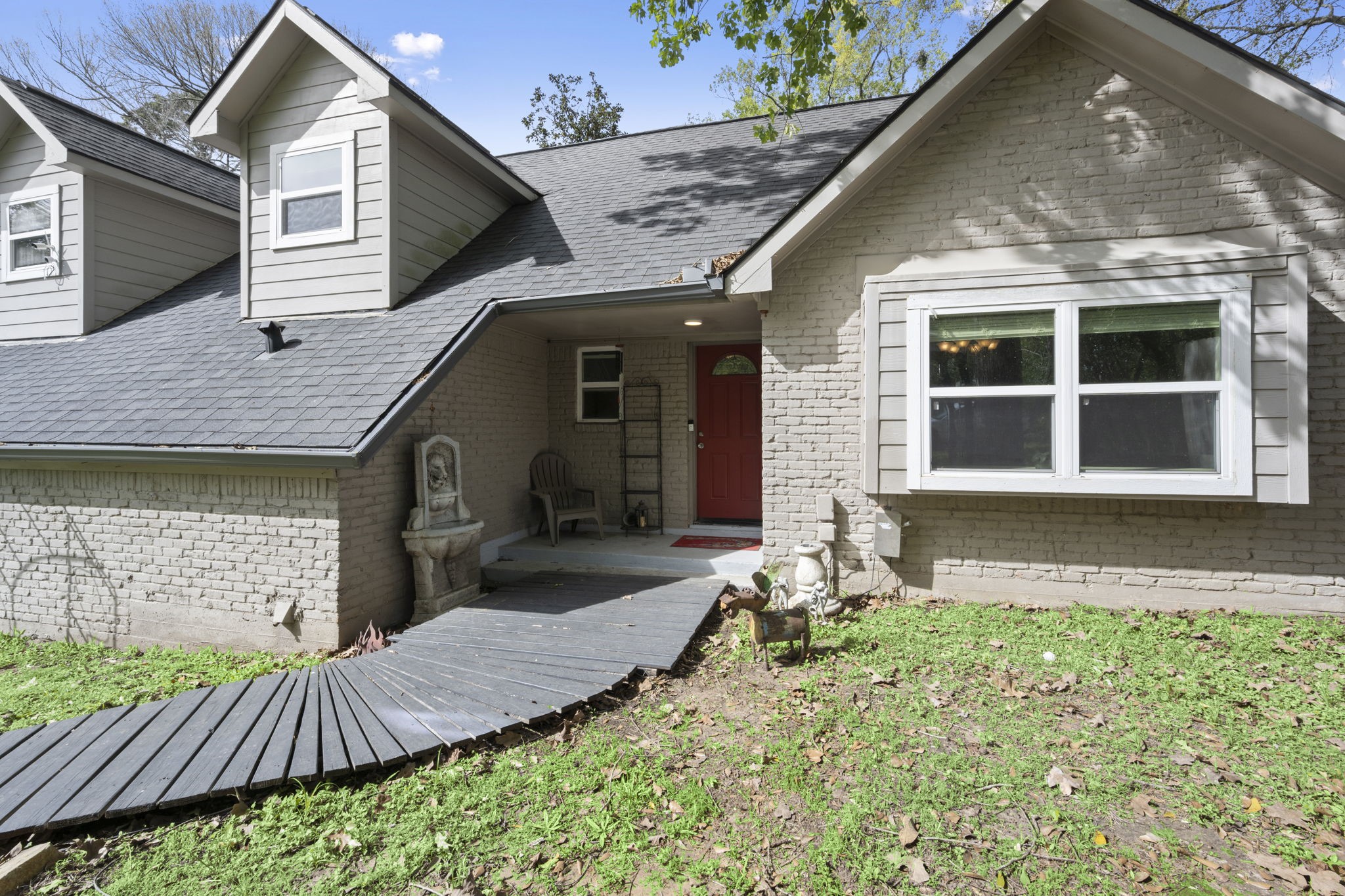 3414 Rustling Pines Street Spring, TX 77380 - Photo 3 of 26 a front view of a house with garden