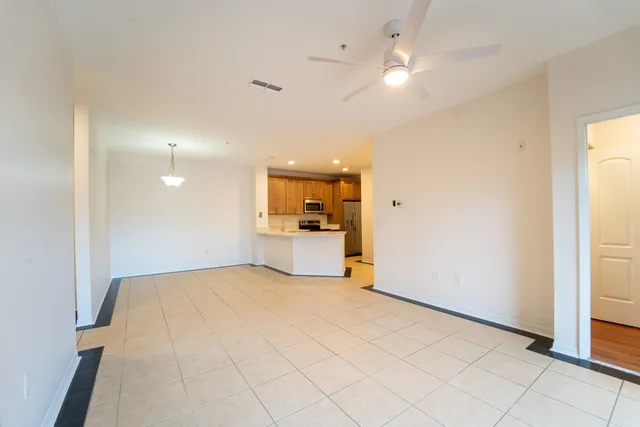 a view of a kitchen with a sink and a window