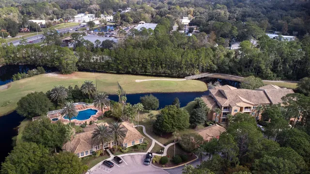 an aerial view of a house with yard