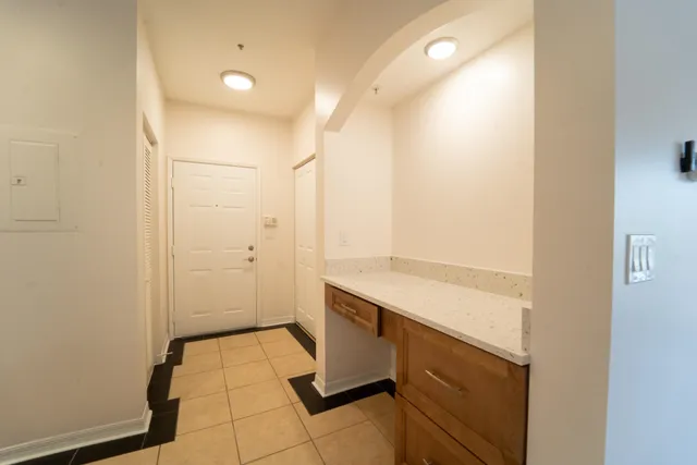 a room with a sink and a mirror