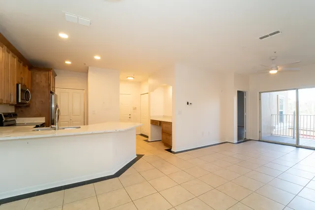 a view of a kitchen with a sink and cabinets