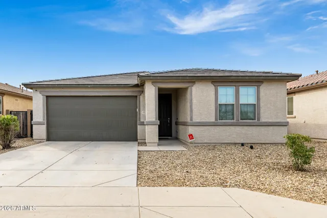 a front view of a house with garage