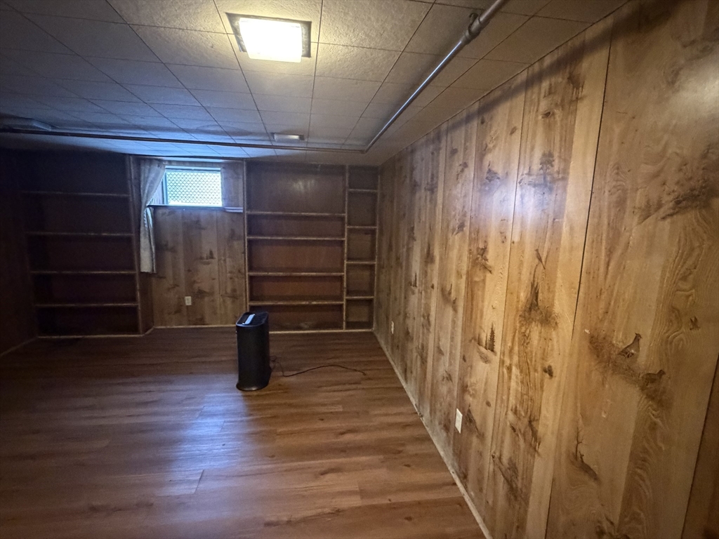 34 Adams Avenue Saugus, MA 01906 - Photo 2 of 8 a hallway with wooden floor and stairs