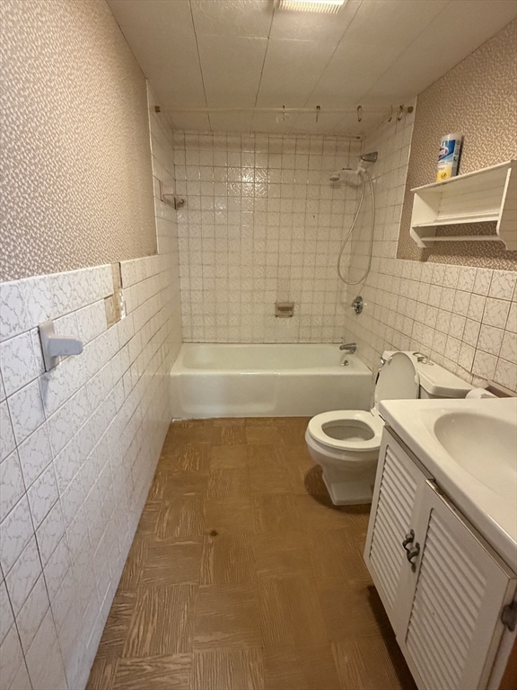 34 Adams Avenue Saugus, MA 01906 - Photo 8 of 8 a bathroom with a sink a toilet and bathtub