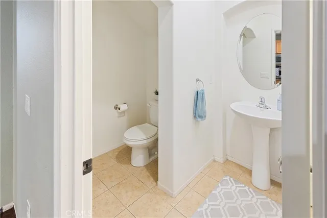 a bathroom with a toilet sink and shower