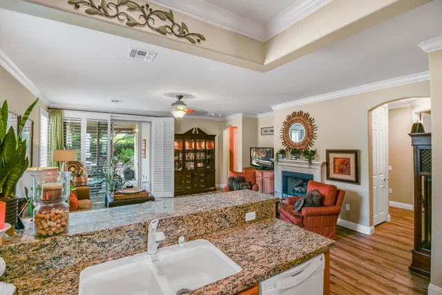 a living room with fireplace furniture and a flat screen tv