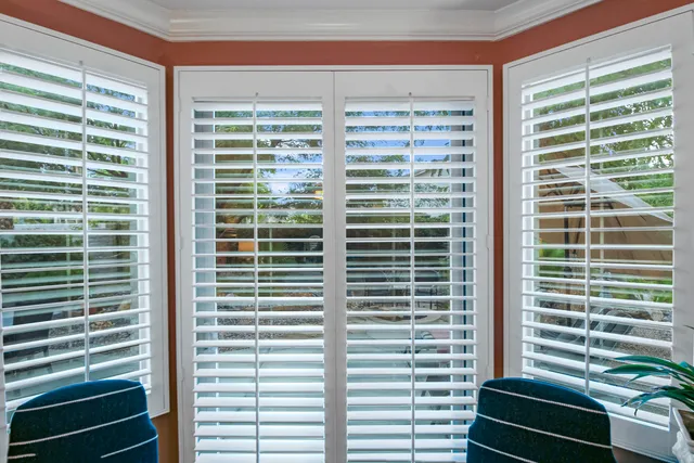 a bathroom with a granite countertop sink a large mirror and a shower