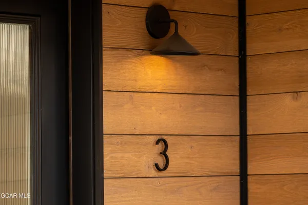 a large kitchen with stainless steel appliances granite countertop a stove and a refrigerator