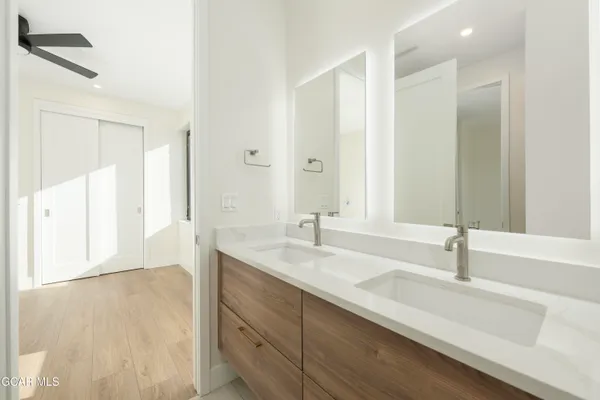 a view of a big room with wooden floor and closet