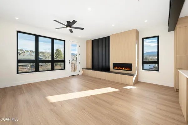 a view of a balcony with wooden floor