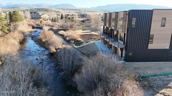 a view of an outdoor space with lots of trees