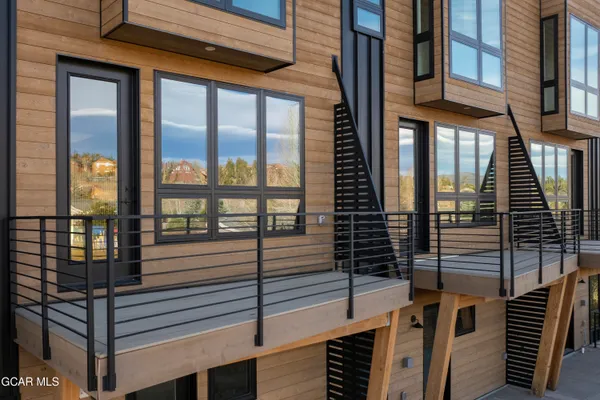 a large white kitchen with a large window