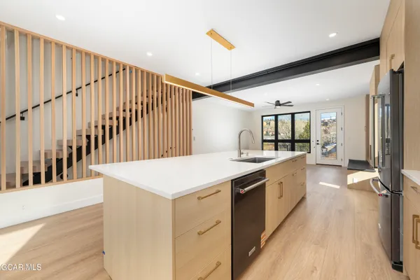 a kitchen with appliances and cabinets